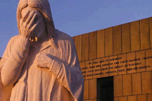 In the glow of sunset, Jesus weeps for the victims and their families.gif