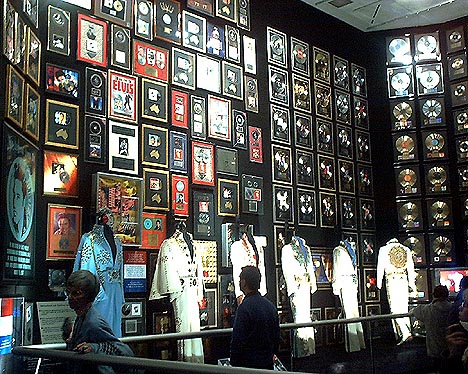 wall of records and suits 